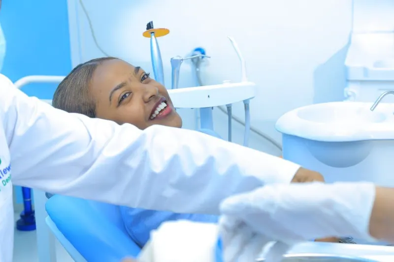Smiling patient in the dental chair at Dr. Akalewold Dental Clinic